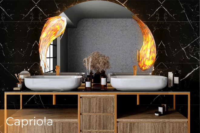 Capriola bulb on a circular-shaped customized mirrors above an elegant bathroom sink.