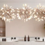 Custom lighted mirror in elegant bathroom with artistic ceiling lights, double sinks, and minimal modern decor.