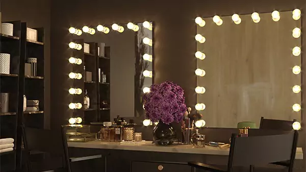 Thumbnail of two Hollywood mirrors above a vanity cabinet with two canvas folding chairs.