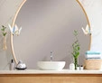 A small circular-shaped lighted mirror with a stylish formina lamp gives ample light in a bathroom.