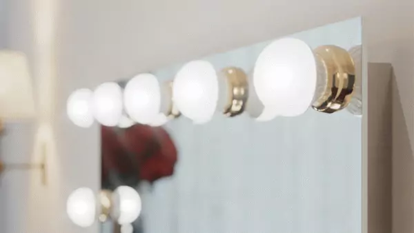 Preview of a frosted light bulb with a gold ring built into a unique mirror.