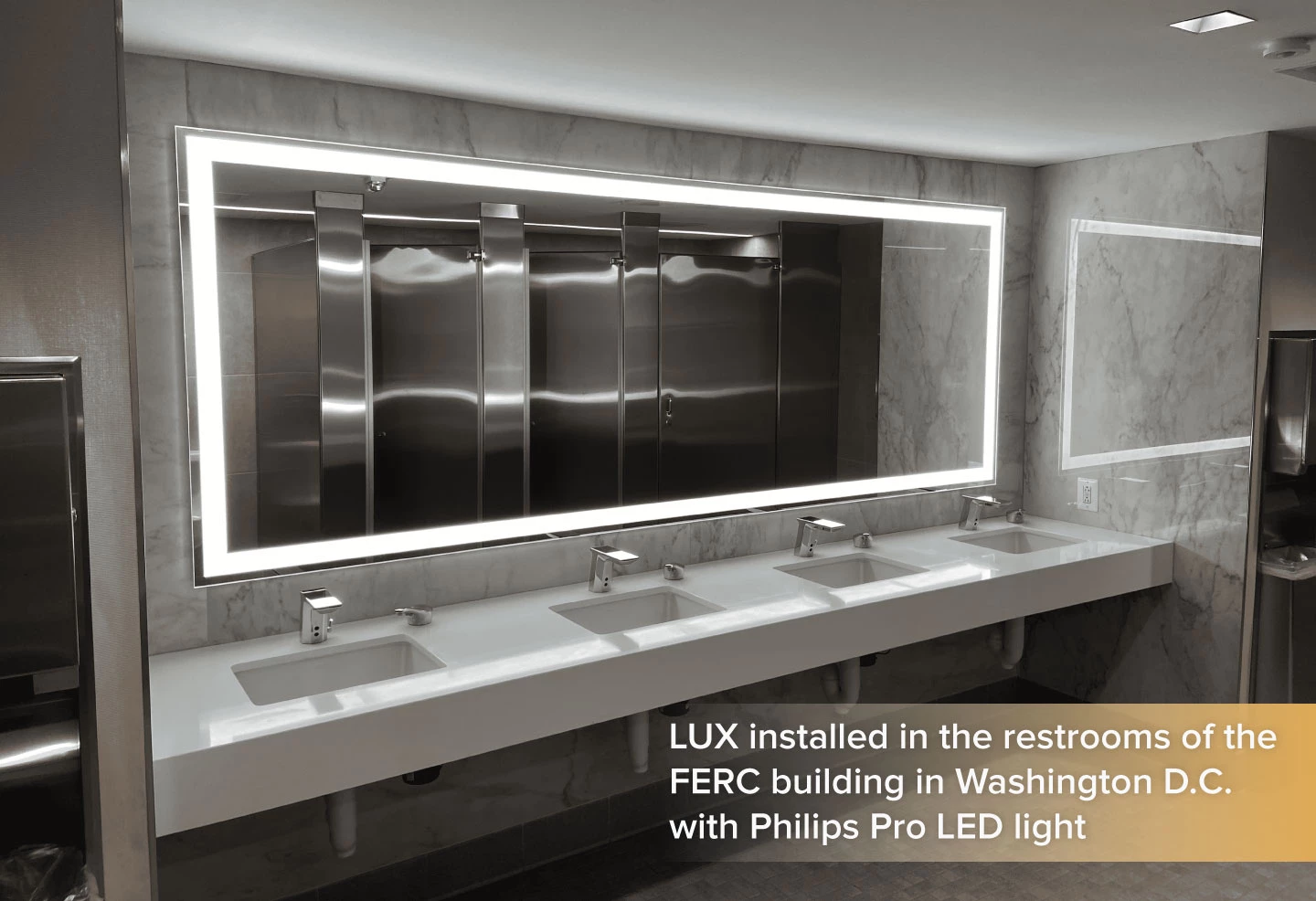 LUX mirror with Phillips Pro LED light installed in a porcelain wall above the sink.