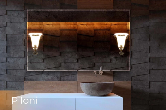 Piloni lamp in a custom mirror set on the wall above a brown stone sink bowl.