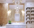 A tiny of mirror with a ribolla lamp above a white single sink in a golden-wall bathroom.